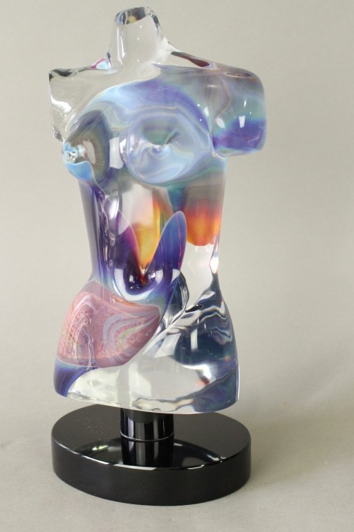 Dino Rison, Murano Glass Female Torso: Dino Rison, Murano glass female torso on stand, signed on plinth, Studio Rosin paper labels et. al. fine condition with swirling colors mixed with clear crystal, 13.5" x 6" x 4".