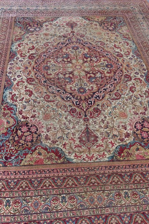 Antique Laver-Kerman Rug, 14.2' x 10.6': Antique Laver-Kerman room size rug, 14.2' x 10.6', c. 1900-10, busy all over floral design on neutral ground, some low areas but overall good condition with no holes, or tears or moth damage. Fringe m