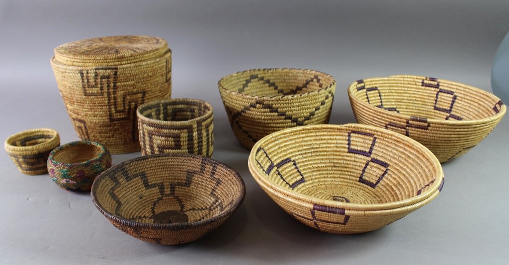 Collection of Eight Native American Baskets: Collection of eight (8) Native American baskets: 8" x 9" diameter basket with lid, 7.5" x 2.5" tight weave bowl, 4.25" x 4.75" basket, 2.25 x 3.5" mini basket, 2" x 4" Iroquois "Whimsy" beaded basket,
