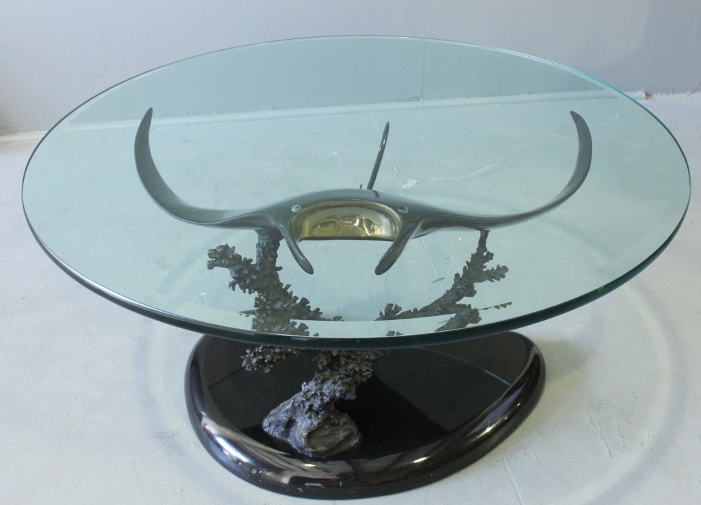 Dale Hanson Bronze "Manta Ray" Table: Dale Hanson bronze sculpture "Manta Ray" over coral branch, this sits atop polished black marble base, edition of 2000, signed, excellent condition. Beveled glass top 38" diameter, 20" tall.