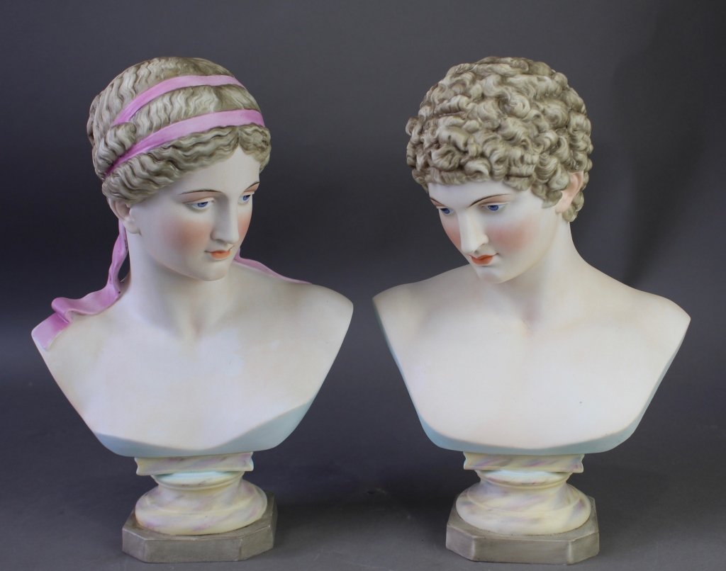 Pair of Painted Bisque Porcelain Busts: Pair of painted bisque porcelain busts, male and female, probably French, but signed only with cipher, both 12.5" x 9" in good condition, 20th century.