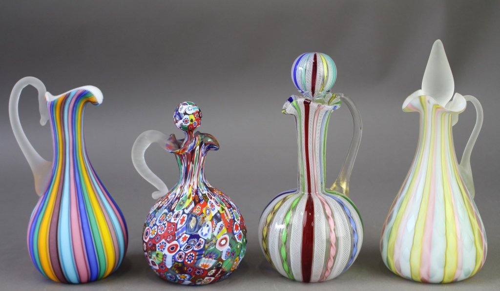 Group of Art Glass Cruets & Ewer: Group of four: 3 art glass cruets with stoppers, 8" rainbow satin quilted (stopper stuck), 6" cane rod millefiori, 7.5" colorful Venetian Latticino. Also, 7" colorfully striped ewer, all in good condi