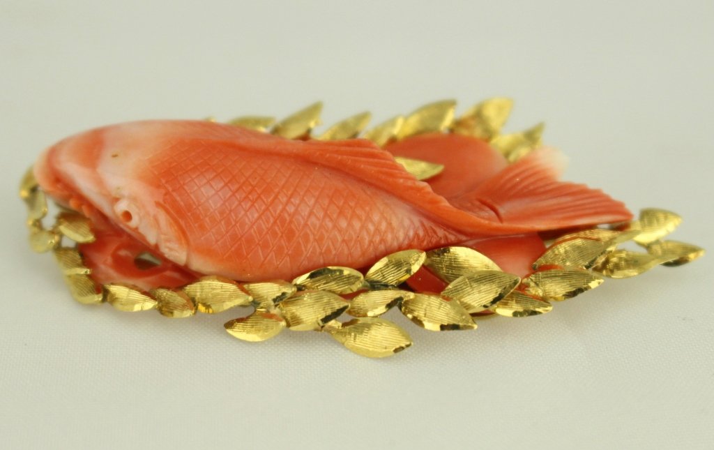 Carved Coral Carp PIn: Exquisite carved coral "Carp" set in 18K gold pin, fine workmanship and detail, heavy gold leaves surrounding an open work backing, 2.5" x 1.25", 16.3 grams.