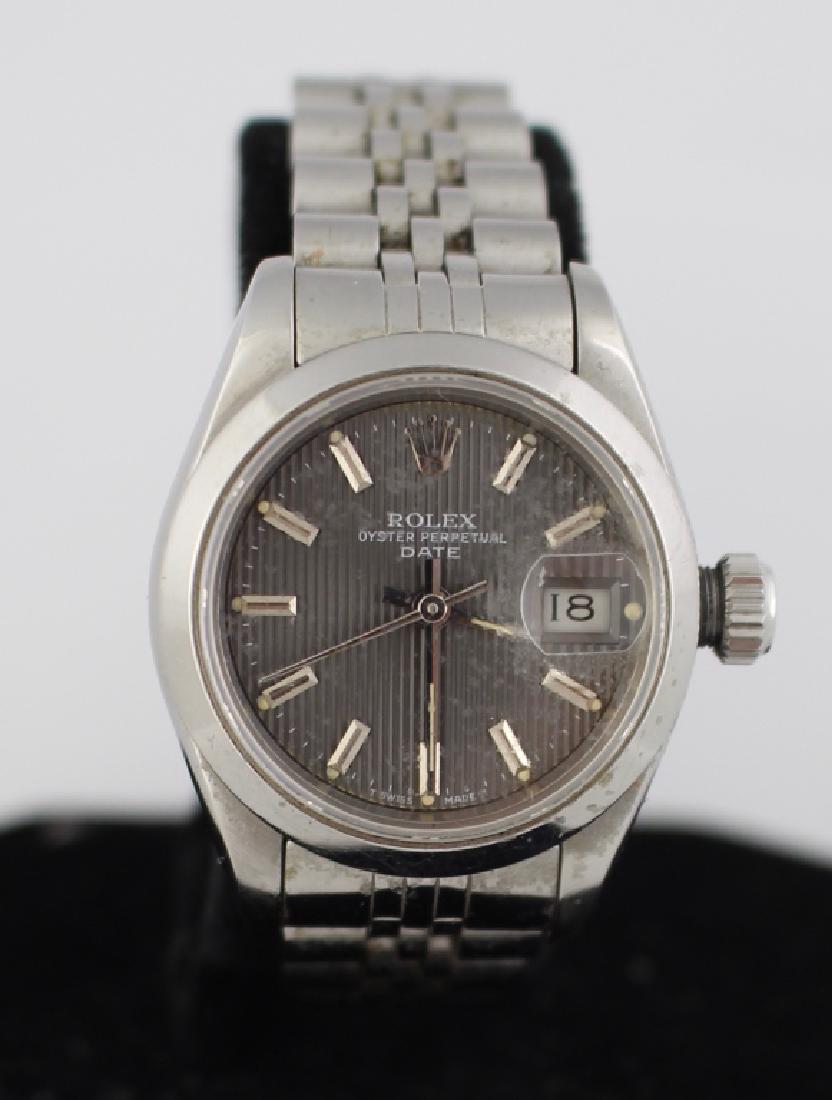Lady's Rolex Oyster Perpetual Watch: Lady's Rolex Oyster Perpetual Datejust watch, stainless steel, smooth bezel, 30 jewel chronometer movement, with Jubilee bracelet #B6251, purchased 12/17/86, serial #R691604, running, papers.