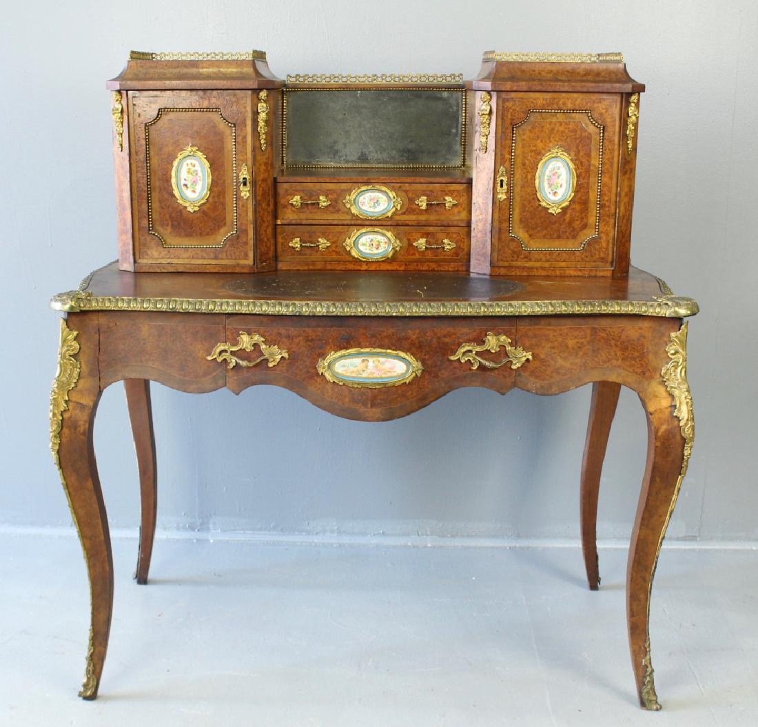 Edwards & Roberts of London Desk: English early 19th century desk, burled and bird's eye veneers, carefully placed Sevres quality hand painted medallions, ormolu attachments, pierced gallery atop the twin compartmented storage units, 