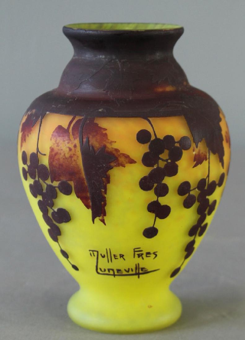 Muller Freres, Luneville, French Art Glass Vase: Muller Freres, Luneville, French cameo art glass vase, 3 colors with predominant grapes and leaves on orange and yellow ground, 7", good condition.
