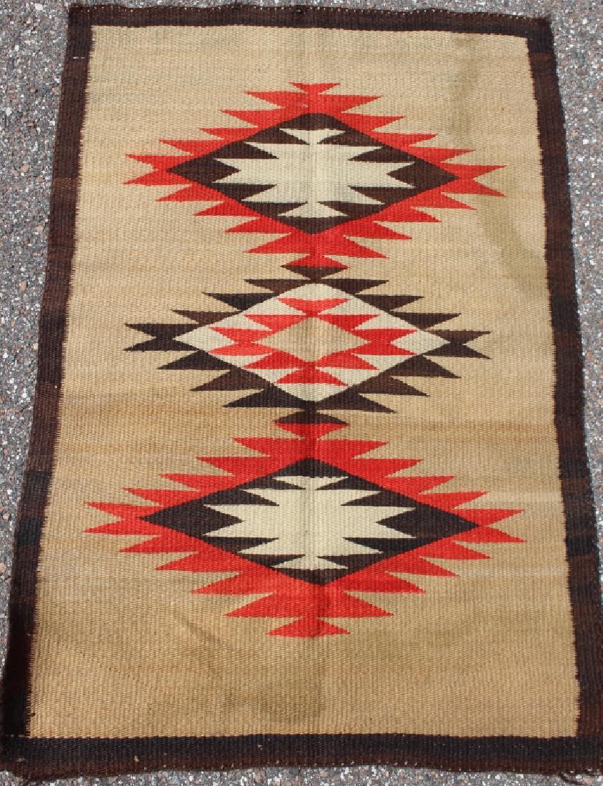 Navajo Blanket, c. 1920-30, 40 x 27: Navajo blanket, c. 1920-30, brown border, 3 central medallions on tan field, minor water stain (as found), tight weave, good condition. 40" x 27".
