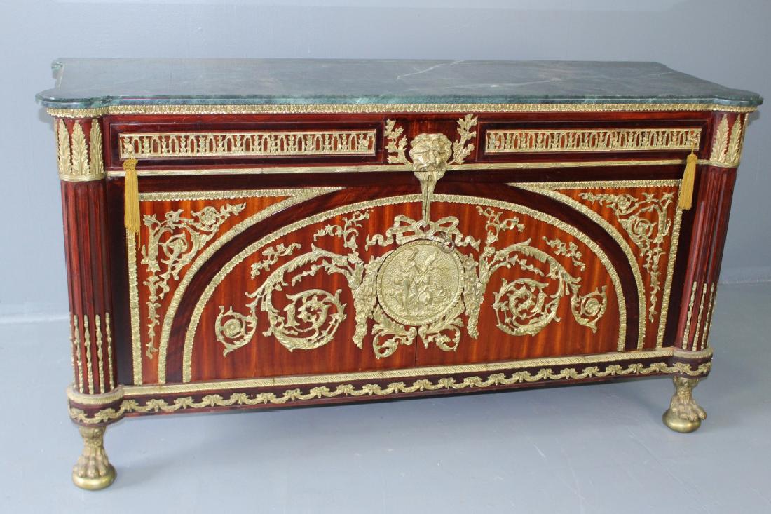 French Empire Style Marble Top Credenza: Contemporary French Empire style marble top credenza. Heavily adorned with gilt ormolu, all resting on large bronze animal paw feet, like new condition, 36"h, 66"w, 22"d.