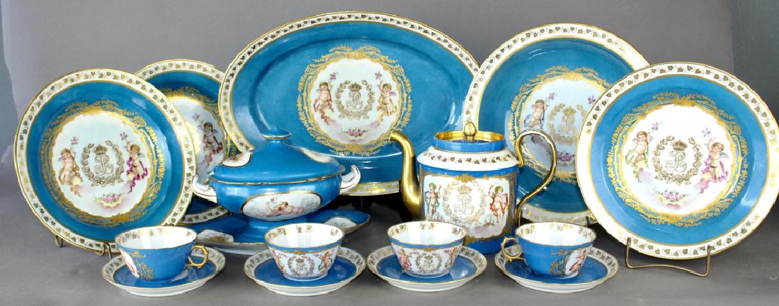 French Porcelain Dinnerware Chateau des Tuileries: French porcelain dinnerware by Chateau des Tuileries, Sevres marks, blue crown LP, Limoges marks, Sevres blue with cupids and gold monogram and crest. 4 cups and saucers, teapot, 3-9.5" bowls (one wit