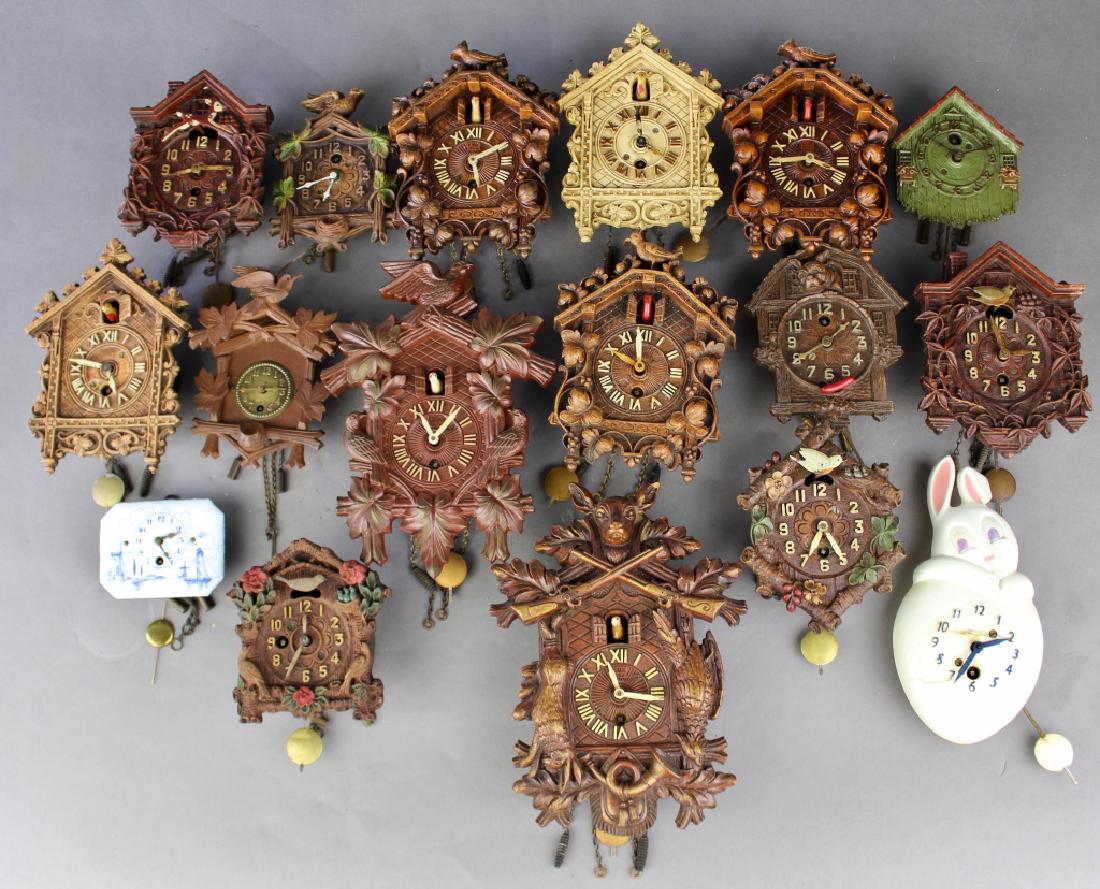 Collection of 17 Miniature Wall Clocks: Collection of 17 miniature wall clocks: most cuckoo style, some German made, some American, good condition (bunny clock has stress cracks in body), largest 7.5" x 5.5", smallest 4" x 3.5".