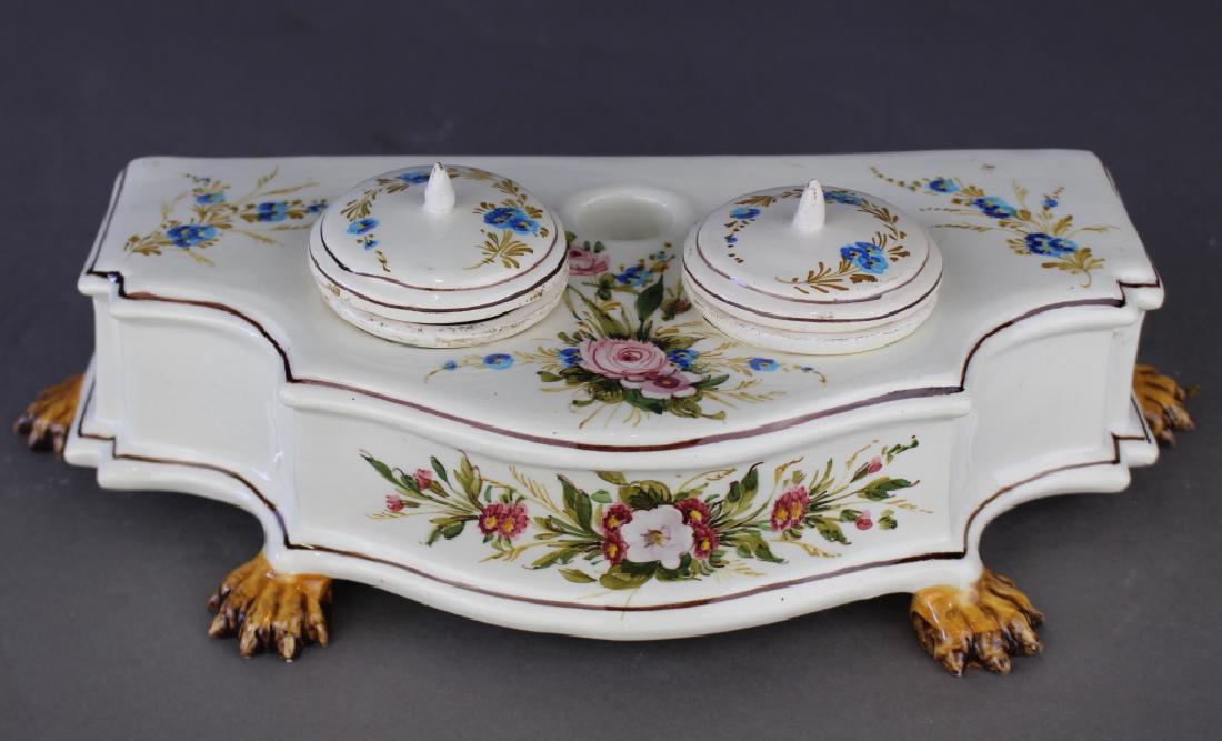 Italian Faience Porcelain Double Inkwell: Italian faience soft paste porcelain double inkwell, delicate hand painted floras, string out lines, five toe paw feet, marked Italy, c. 1900, in remarkably good condition, 4.5" x 12" x 5".