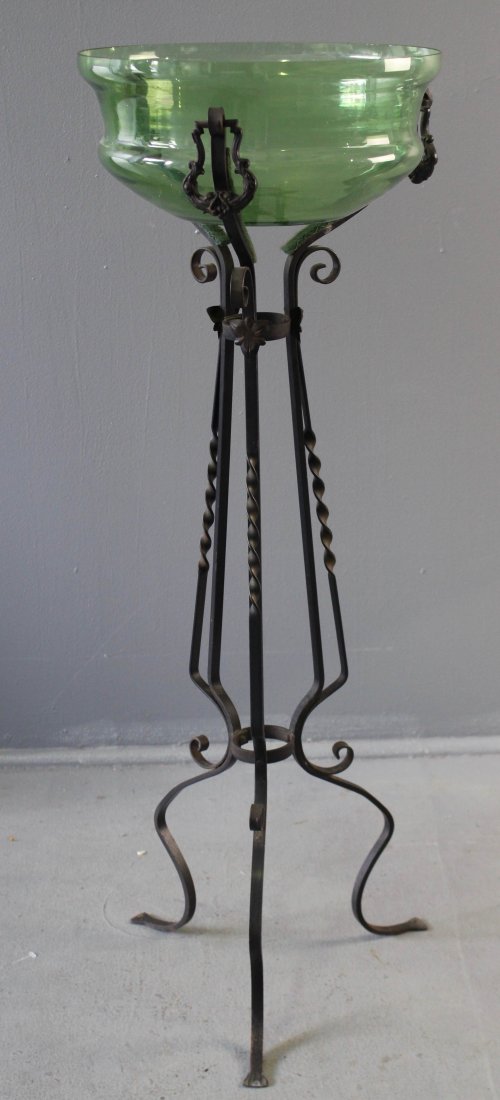 Wrought Iron Stand with Green Glass "Fish Bowl": Wrought iron stand, c. 1920, with green glass "fish bowl". Ornate tri-leg stand with fitted 13.75" x 6" glass bowl, stand is 40.5", good condition (bowl in very good condition.
