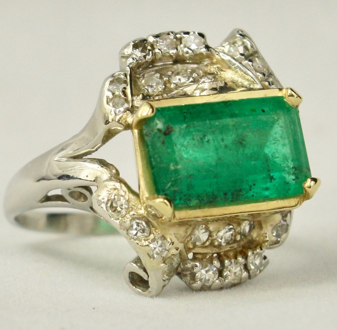 Natural Colombian Emerald Ring: Natural Colombian emerald ring: Emeral is 3.5 carats set in 14k gold, ring set in platinum with 25 tcw. diamonds inset and surrounding the stone, ring size 7. Includes current GIA appraisal of $6700.