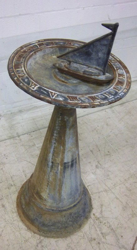 Mid 20th C. cast iron sundial with boat: Mid 20th C. cast iron sundial with boat 31"h