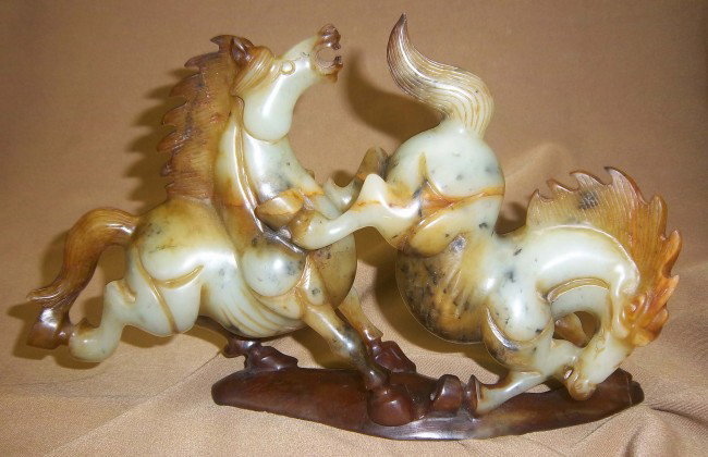 Carved horses galloping and jumping: Carved horses galloping and jumping Auction Estimate 100-1000