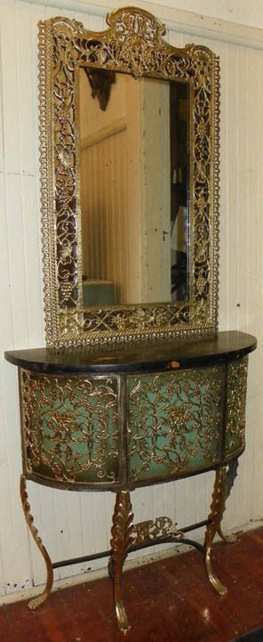 C1930 Cast bronze and iron marbletop console: C1930 Cast bronze and iron marbletop console with mirror attributed to Oscar Bach 67 x 30 x 11 1/2 Auction Estimate 500-1000