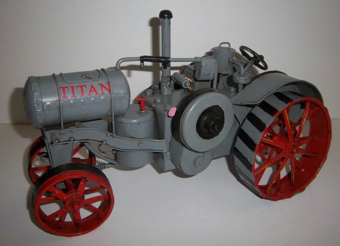 Mid 20th C. tole painted farm tractor: Mid 20th C. tole painted farm tractor 8"h Auction Estimate $100-400