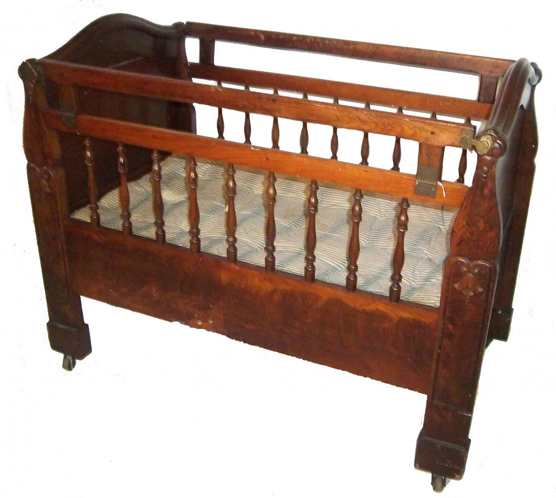 19th C. Meeks crib with fold down sides: Rare 19th C. American Victorian rosewood and mahogany cradle with fold down sides by Meeks 39"hx45"wx26 1/2"dAucton Estimate $350-700