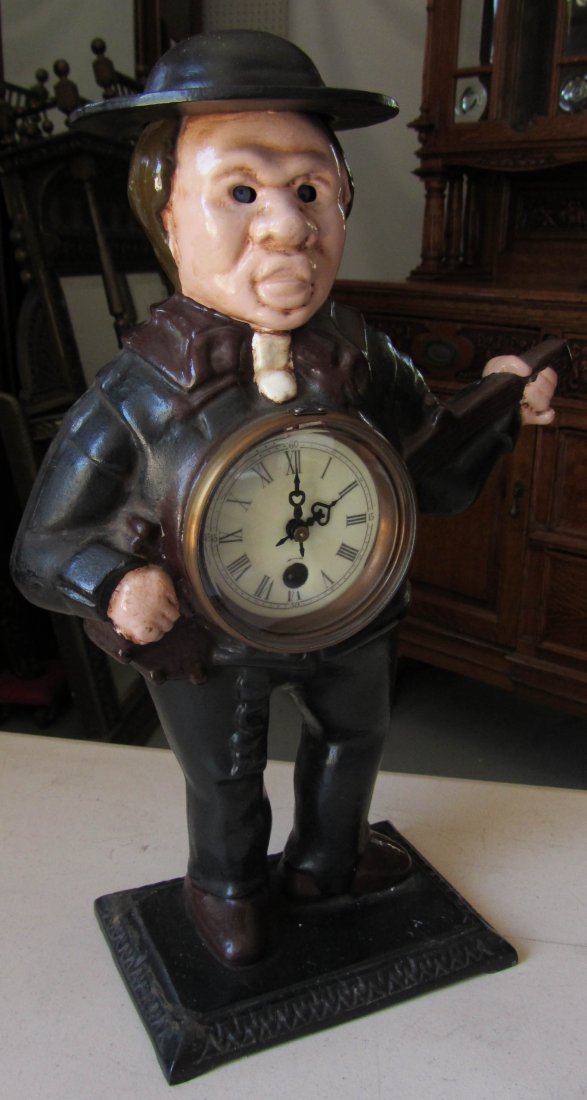 Man with banjo clock: Man with banjo clock 15"h Auction Estimate 100-300