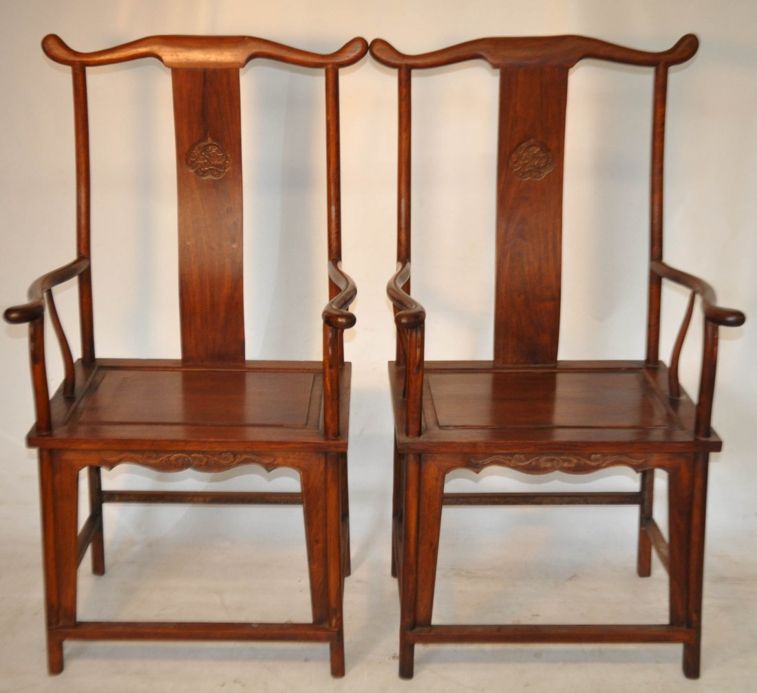 Early 20th C. Pr. Huanghuali wood arm chairs: Early 20th C. Pr. Huanghuali wood arm chairs, decorated with carved peach shape dragon on the back splash 48 x 25 x 21 Auction Estimate 1000-1500 (THESE ITEMS WERE NOT PAID FOR FROM OUR SEPTEMBER 30TH