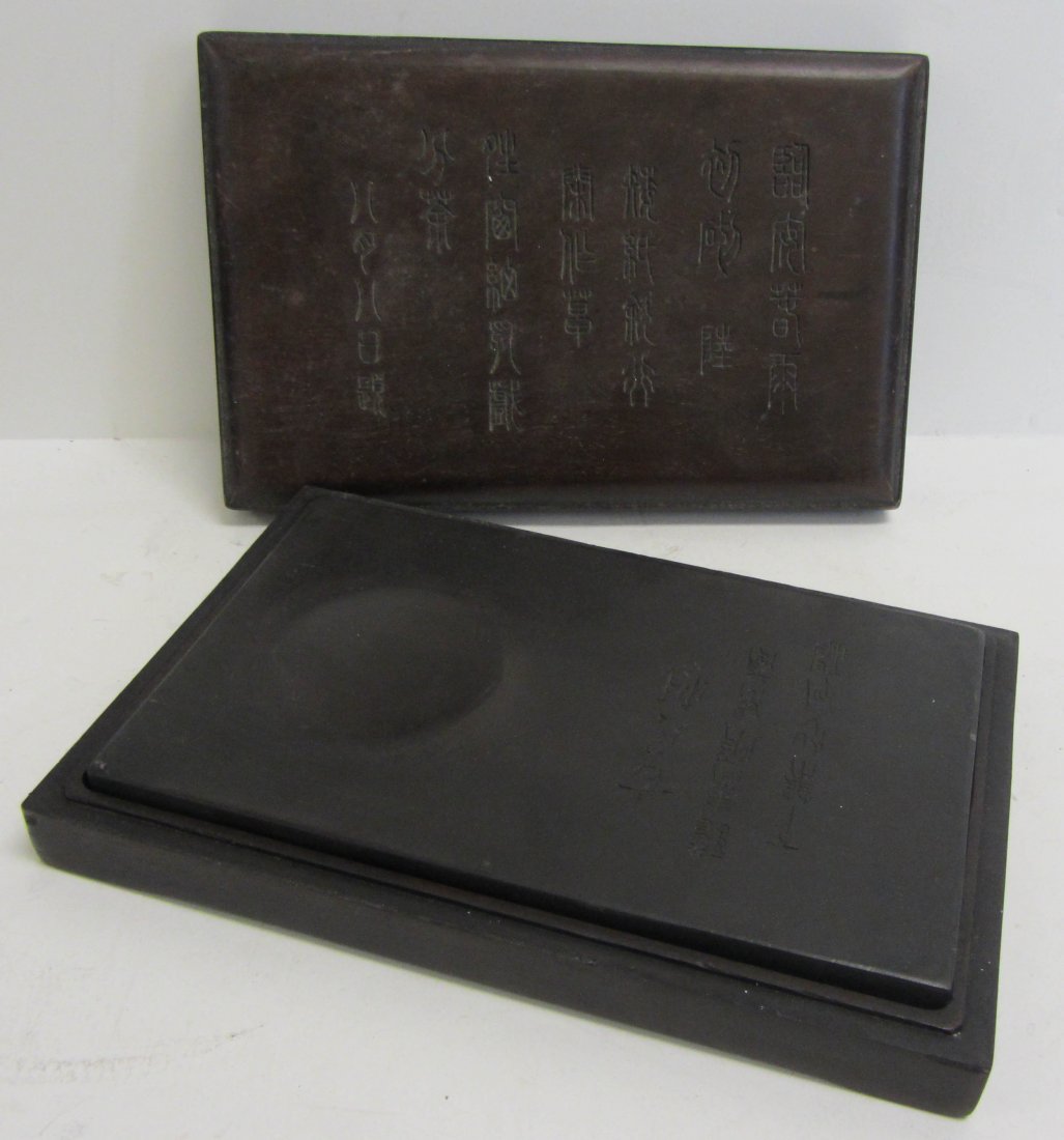 19th C. Chinese Duan ink-stone: 19th C. Chinese Duan ink-stone with carved characters on surface 6 1/2 x 10 Auction Estimate 200-400