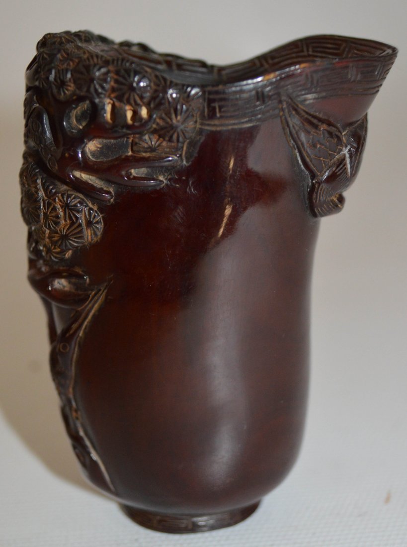 19th C. Rhino horn cup decorated with flowers: 19th C. Rhino horn cup decorated with flowers and bats pattern Auction Estimate 300-500