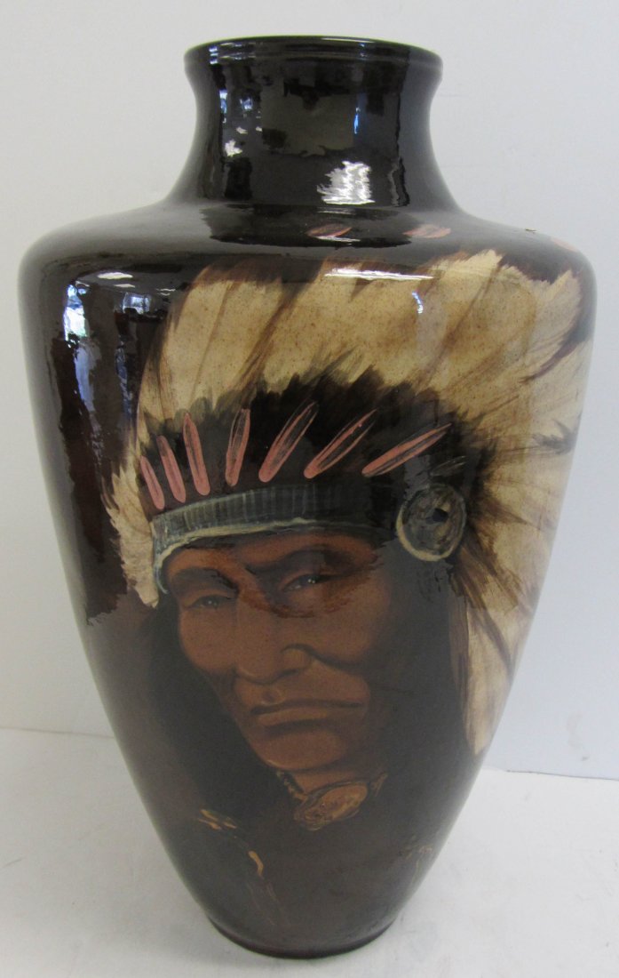20th C. Signed art pottery vase of Indian: 20th C. Signed art pottery vase of Indian 16 1/2"h Auction Estimate 100-300