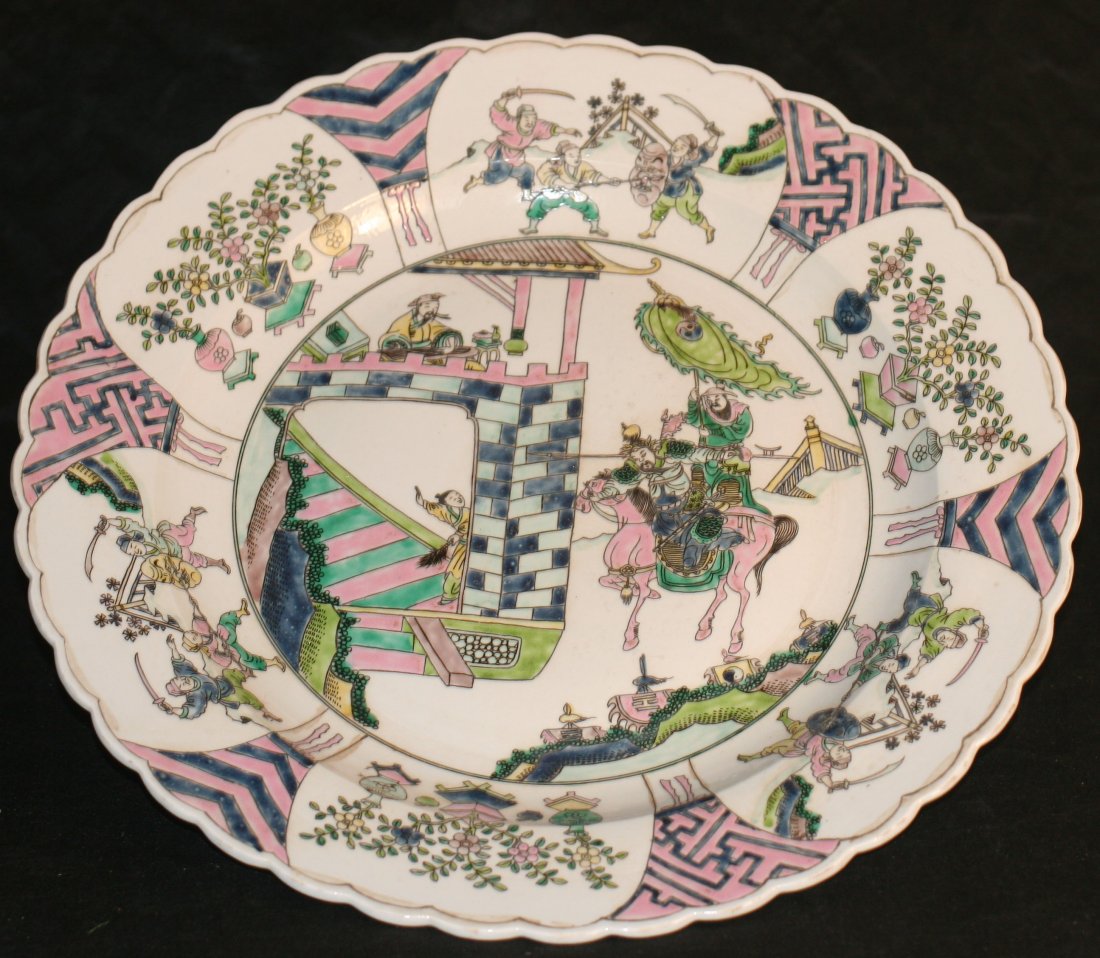 Chinese famille rose plate: Chinese famille rose plate decorated with view of war 17" Auction Estimate 400-600