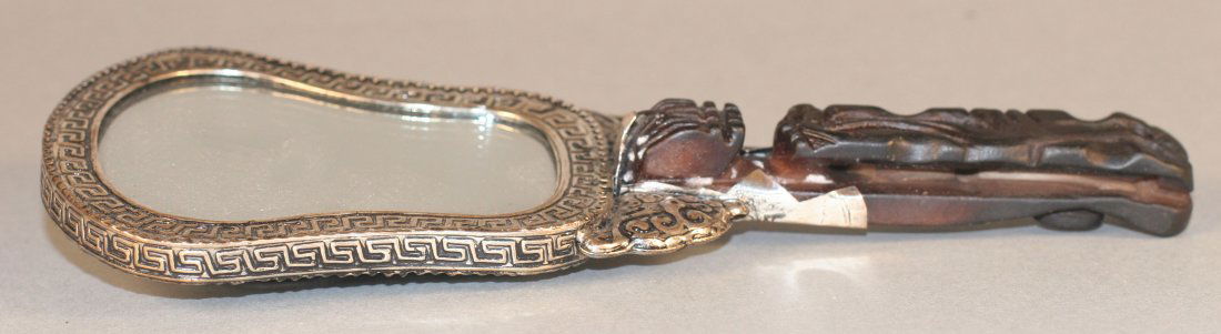 Chinese mirror with carved horn handle: Chinese mirror with carved horn handle Auction Estimate 200-400