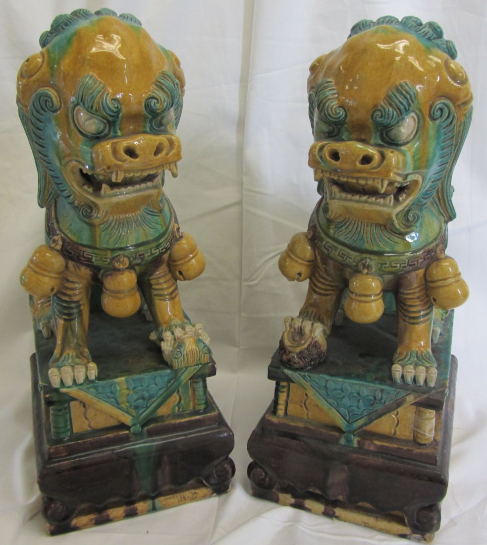 Pr. C1900 porcelain Chinese foo dogs: Pr. C1900 porcelain Chinese foo dogs 17"h Auction Estimate 200-400