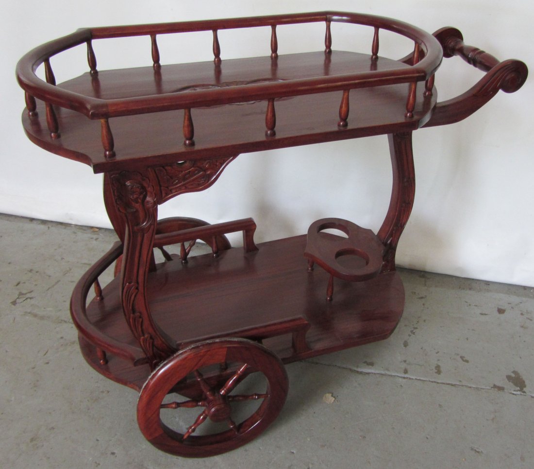 20th C. Mahogany tea cart: 20th C. Mahogany tea cart 32"h Auction Estimate 200-400