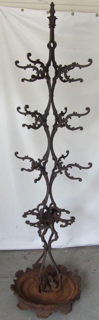 Rare Cast iron American center clothes tree: Rare Cast iron American center clothes tree 83"h Auction Estimate 200-400