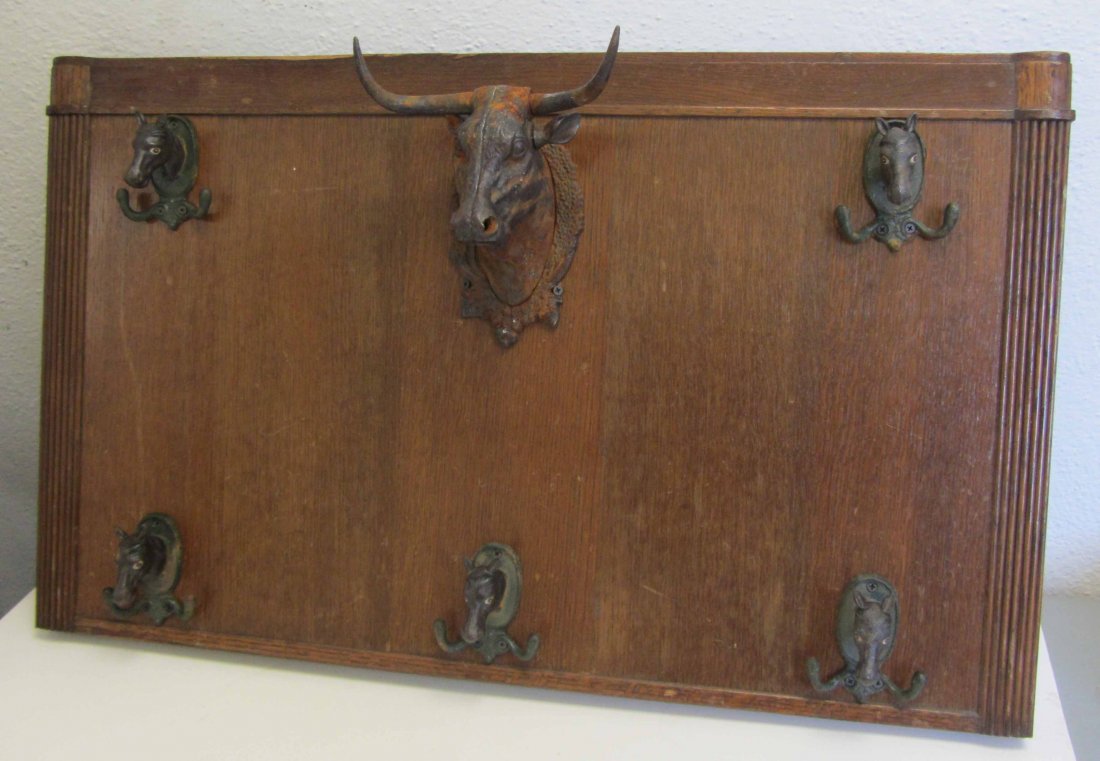 20th C. Wall hanger with cast iron heads: 20th C. Wall hanger with cast iron heads 22 1/2 x 36 Auction Estimate 100-300
