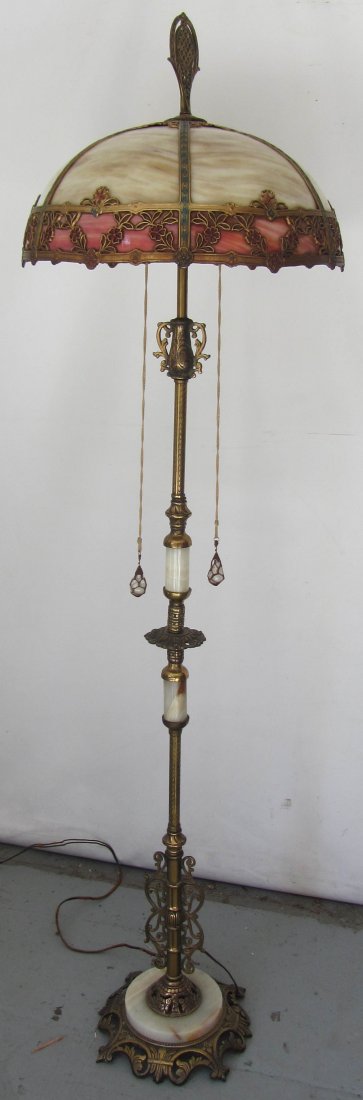 C1900 Stained glass floor lamp by Miller Lamp Co.: Fine Quality C1900 Stained glass floor lamp by Miller Lamp Co. on original onyx and bronze base 67"h Auction Estimate 300-600