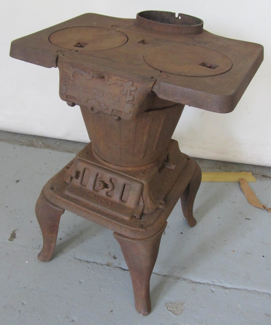 Cast Iron Umco stove: Cast Iron Umco stove 21 1/2"h Auction Estimate 100-300