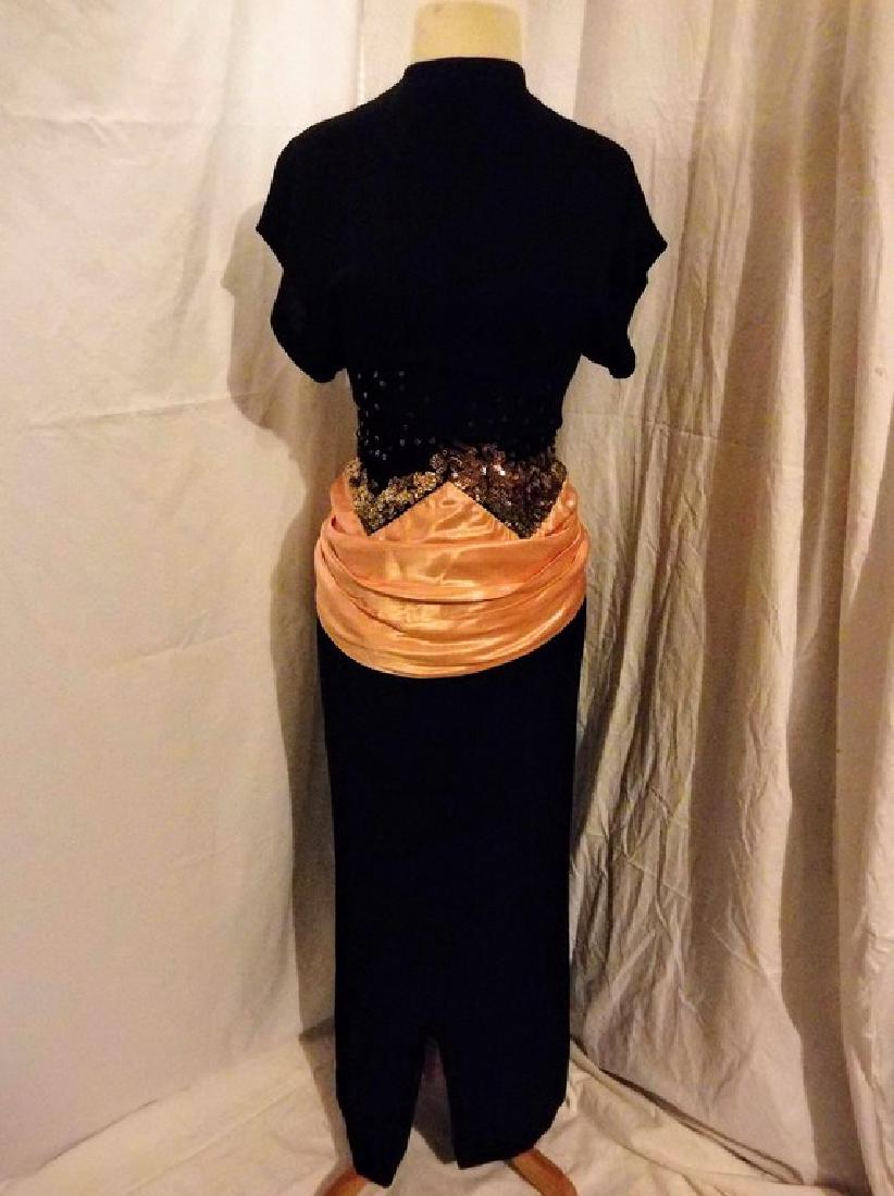 1930's Black Rayon blend Dress with Sequin & Satin: high neck with key hole back, pink satin ribbon is draped at drop waist snaps and ties in back, bronze sequin all around waist ( some missing see photo's) full length, front slit, zips at waist in bac