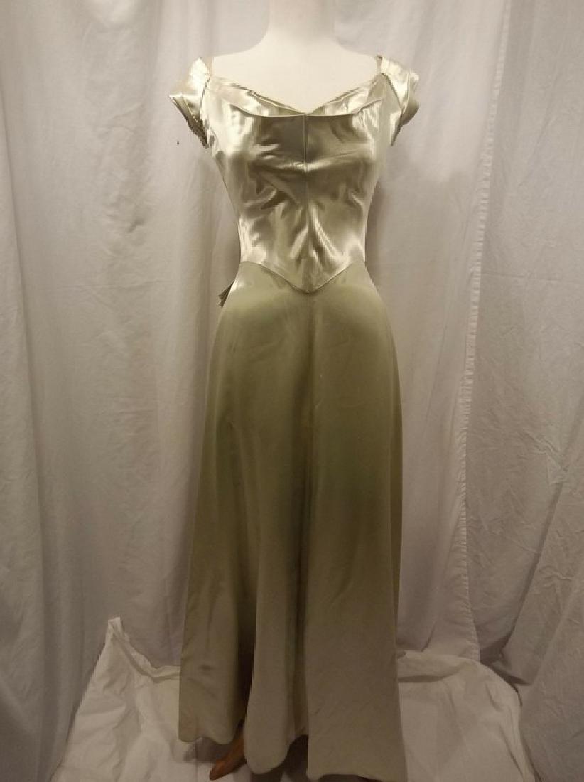 1930 Pale Green Satin Gown with Sweet Heart Bodice: sits low on shoulders with pleated detail, gathered back, free flowing skirt, back zipper, some stains, see photo's, approx. 36 bust, 26 waist