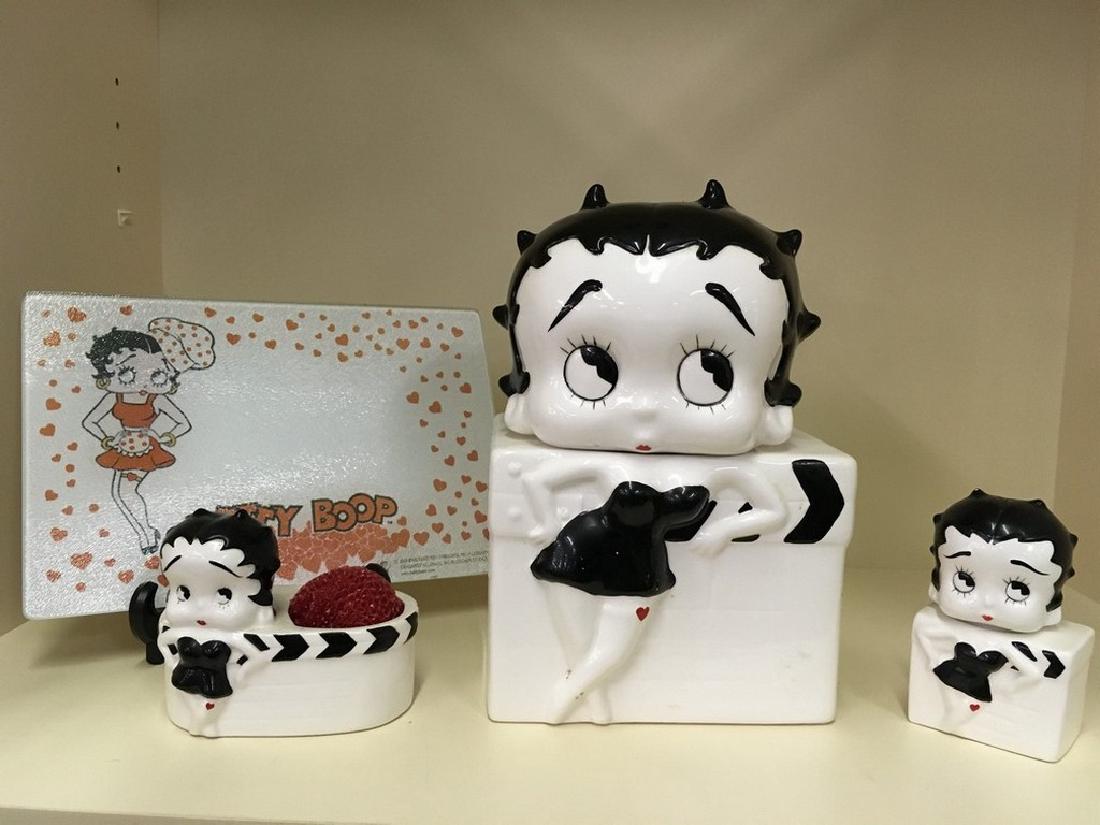 Black and white Betty Boop kitchen lot: Cookie jar, salt and pepper shaker, cutting board, and scrungie holder