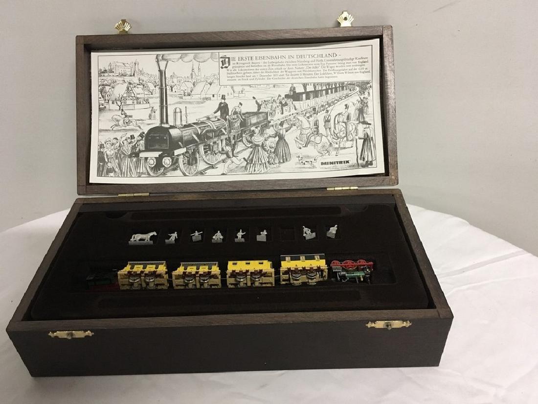Minitrix Dutch Der Adler N scale train kit: This is a fantastic N gauge set-up which includes a 2-2-2 engine and tender with four passenger cars. It is interesting that the engine is actually in the first passenger car, not in the engine car as