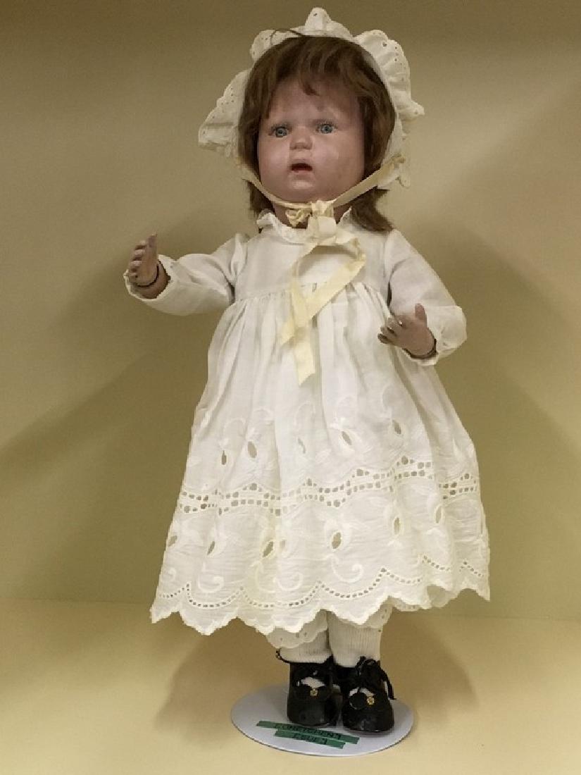 16" Jointed Child Schoenhut Spring Jointed Doll: Jointed at neck arms elbow wrists hips knees. Blue eyes replaced auburn mole hair wig. Marked "Schoenhut 1913" on head, Patent Jan 17 1911 Foreign Countries USA + On Back. White dress and slip with ey