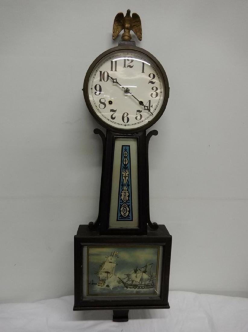 New Haven Banjo Clock, 8 day, half hour strike: Brass eagle finial, ship scene, key included, approx. 36 inches tall