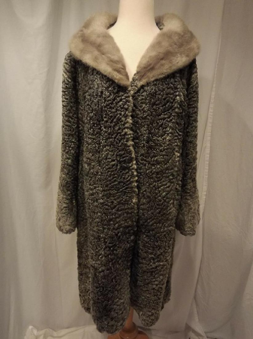 persian lamb grey coat: 1950's genuine grey Persian lambswool 3/4 length a-line coat with a blue iris Mink shawl collar, funnel sleeves, hidden hook/eye closures on the placket, side slash pockets and a black crepe de chine