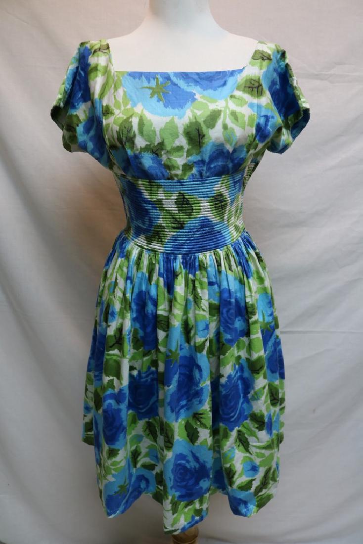 1960's Blue Green Vicky Vaughn Floral Cocktail Dress: square neck, short cap sleeves, fitted band at waist, full skirt, side zipper, approx. 34 bust, 24 waist, some darts let out