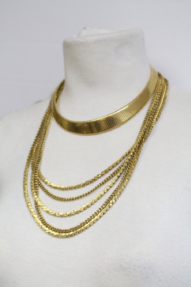 Lot of Two 1980s MONET necklaces: gold tone metal signed MONET. 1 - link choker style 2 - multi-strand graduated chain, both in excellent condition