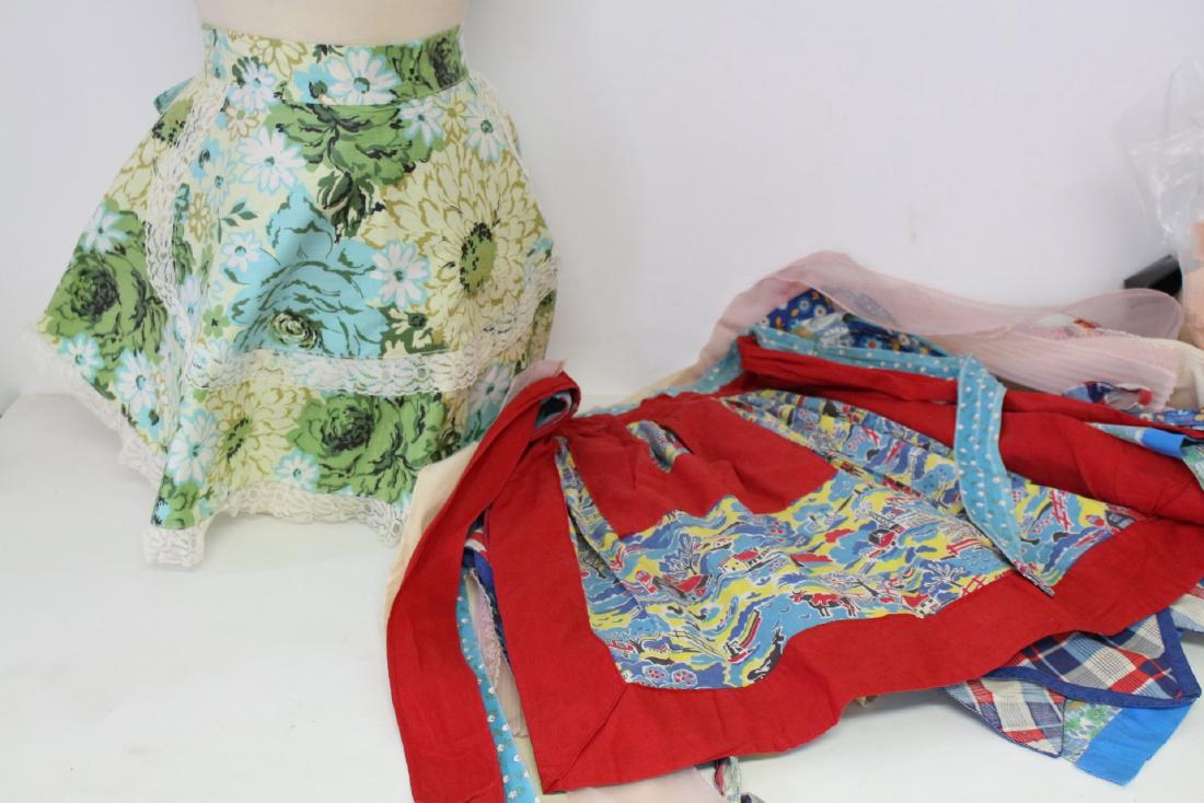 Lot of 8 Vintage Aprons: cotton & nylon fabrics, all in good to fair condition