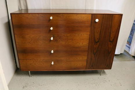 Mid-Century Modern George Nelson Design Herman Miller: stunning piece with white porcelain knobs (one wood replacement) stainless steel legs, 5 draws, some with dividers,, 1 cabinet door with 2 shelves inside, approx. 40 3/4 inches tall, 55 3/4 long, 18 1