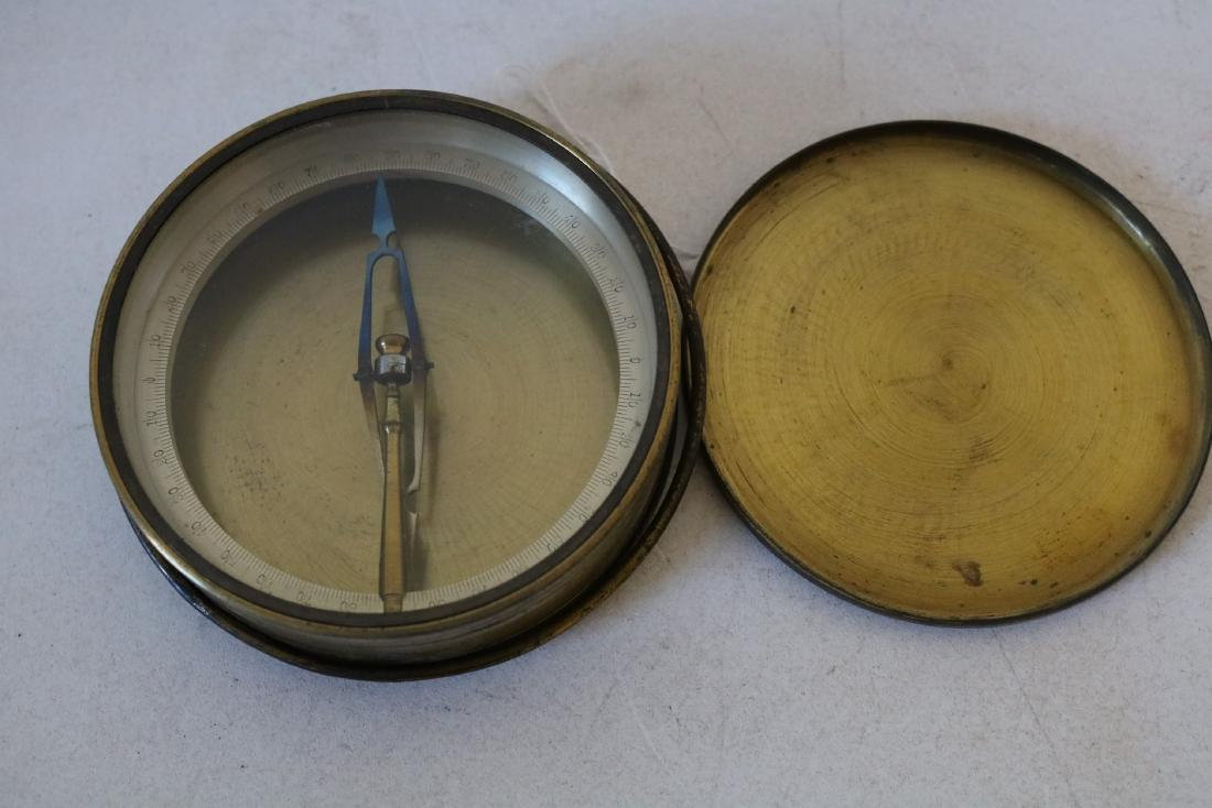 Early Brass Compass: has brass ring for carrying, approx. 4 inches across