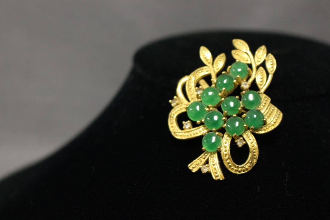 Asian Green Stone Brooch: gold tone metal, jade-like stones. Good condition - 2"