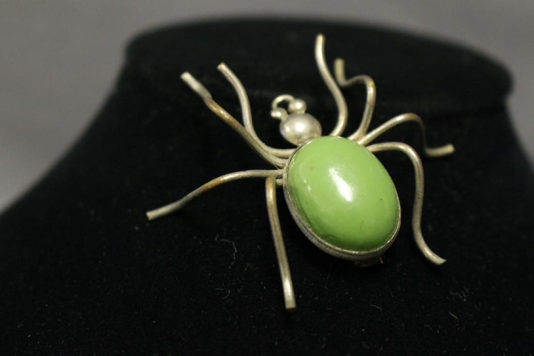 1940s Green Spider Brooch: silver tone metal, green cobachon. 2.25"x2.25"