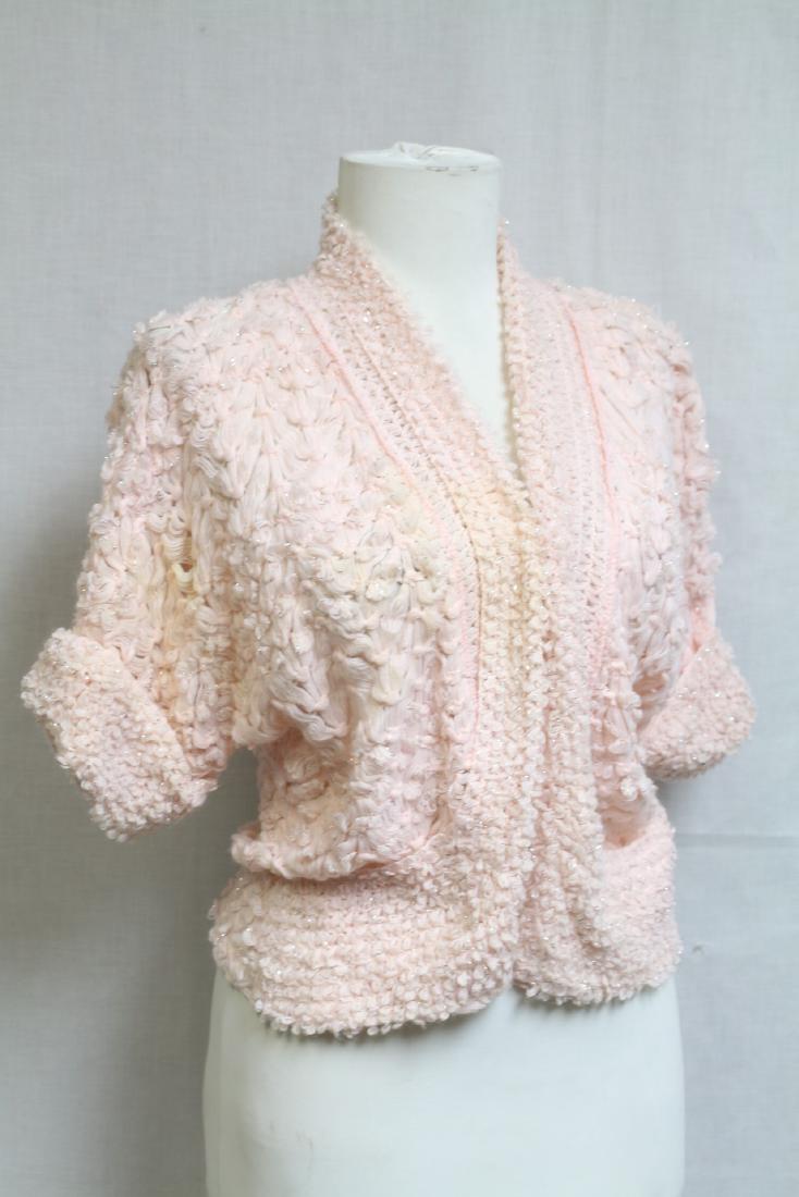1950s Crochet Shrug: Metallic, silver and pink crochet knit fabric. Fair condition, minor yellowing. One size fits most. 21" length.